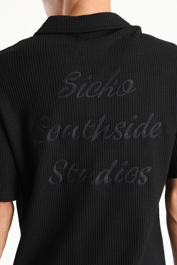 Polo con struttura waffle - nero