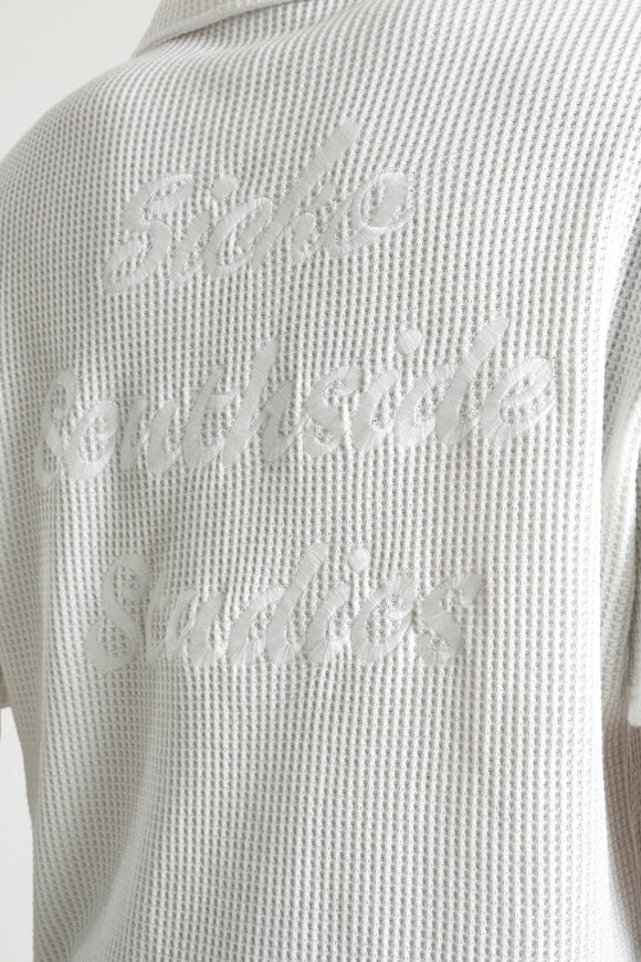 Polo con struttura waffle - bianco