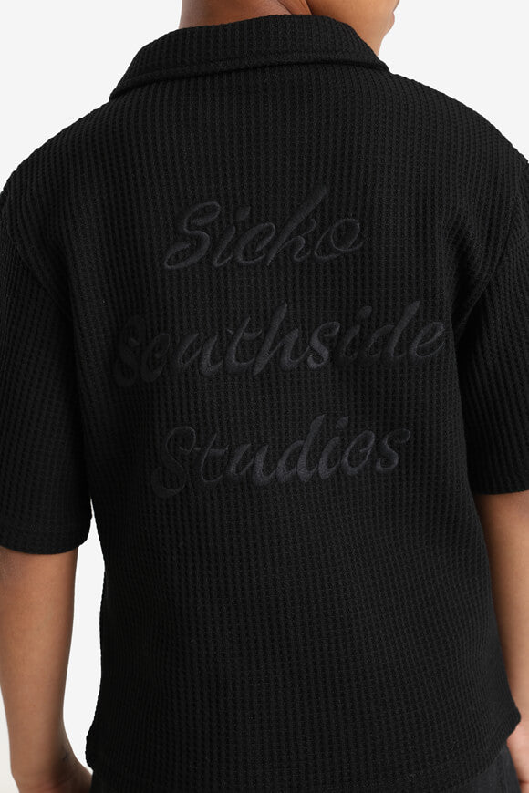 Poloshirt mit Waffelstruktur - Schwarz