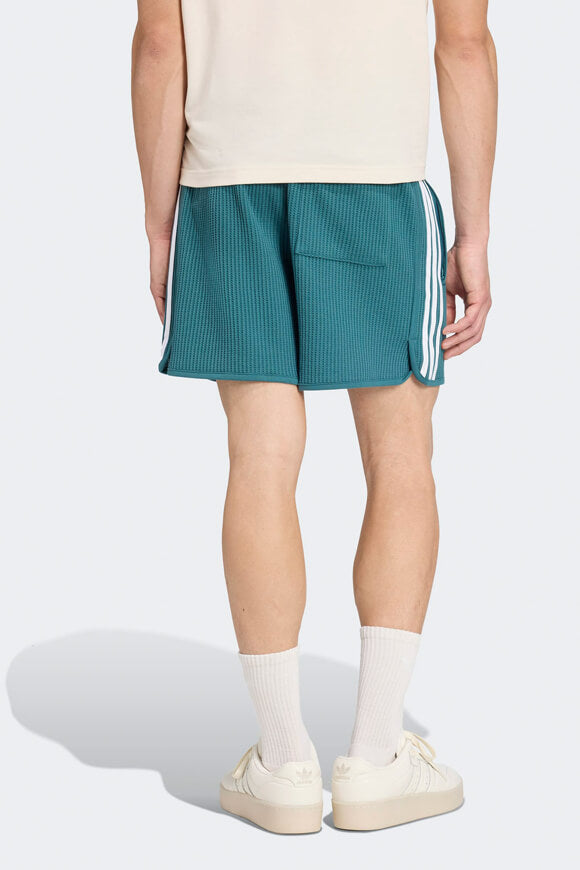 Pantaloncini in tessuto goffrato - Tech Green